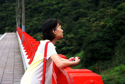Side view of young woman looking away