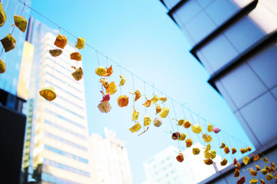 Low angle view of decorations against sky