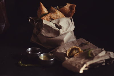 Close-up of food on table against black background