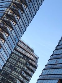 Low angle view of modern buildings against clear sky