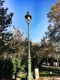 Low angle view of lamp post against sky