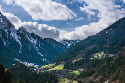 Scenic view of mountains against cloudy sky