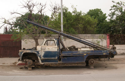 Abandoned pick-up truck on road