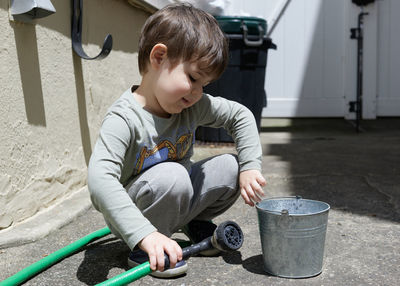 Expressive young boy playing in the back yard