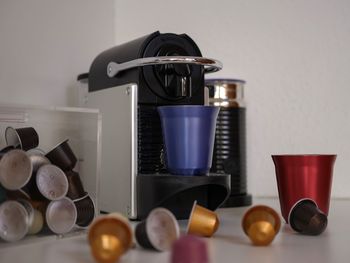 Close-up of coffee cups on table