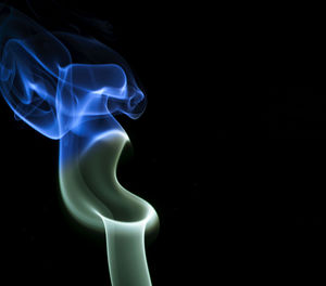 Close-up of smoke against black background