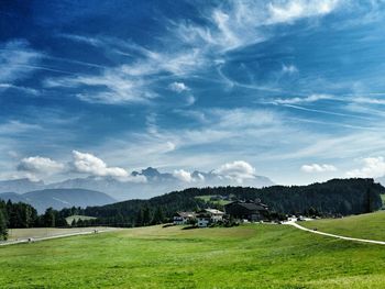 Scenic view of landscape against cloudy sky