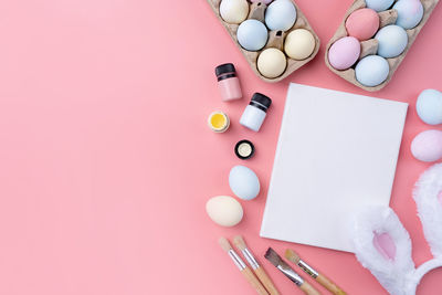 Directly above shot of pills and medicines on pink background