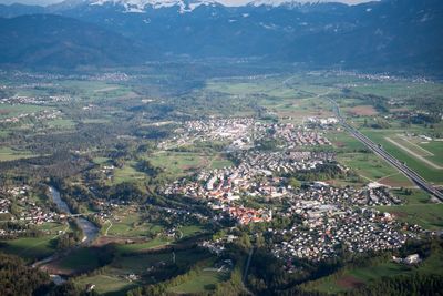 High angle view of field and houses against sky