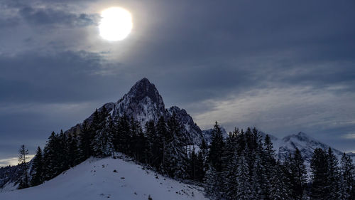 Scenic view of snowcapped mountains against sky during winter