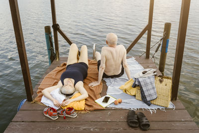 High angle view of senior couple on gazebo over river