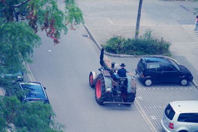 High angle view of vehicles on road in city