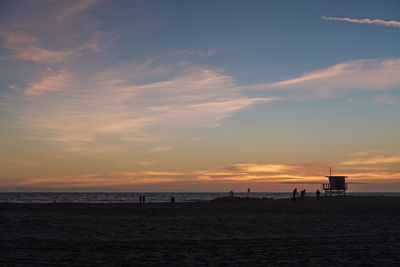 Silhouette of people on beach