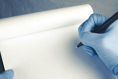 Close-up of hand holding umbrella