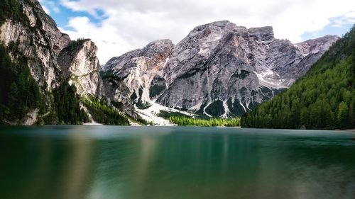 Scenic view of lake and mountains against sky