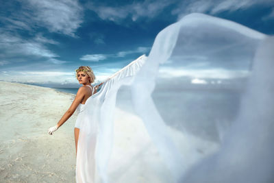 Woman standing on the beach