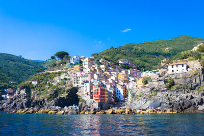 Scenic view of mountains against clear blue sky