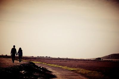 Woman walking on landscape