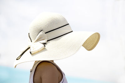 Rear view of woman wearing hat against sky