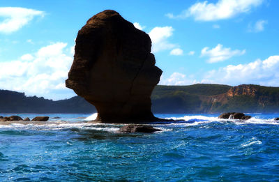 Batu payung in sea at lombok against sky