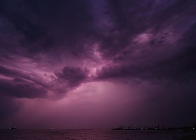 Scenic view of sea against dramatic sky