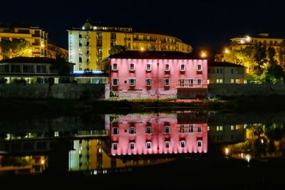 Illuminated buildings in city at night