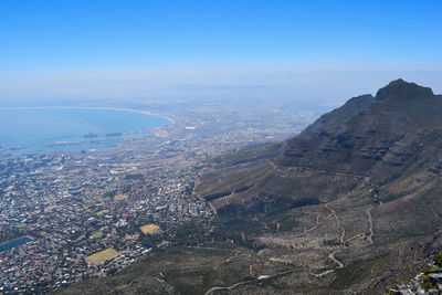 Aerial view of city and sea against sky