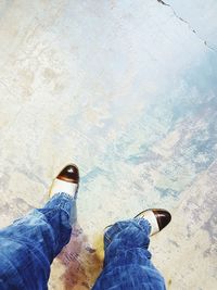 Low section of man standing on floor