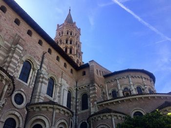 Low angle view of historical building against blue sky