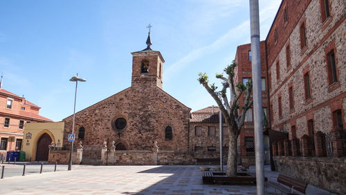 Buildings in city against sky