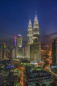 Illuminated buildings in city at night