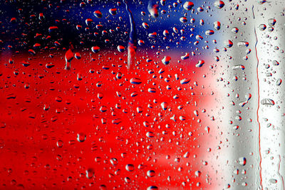 Full frame shot of wet car window glass