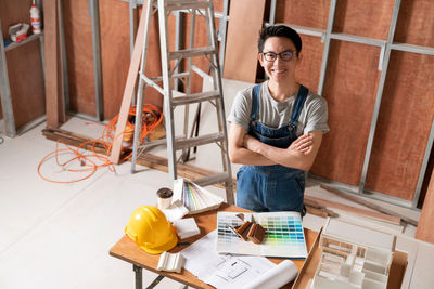 Portrait of a man working on table