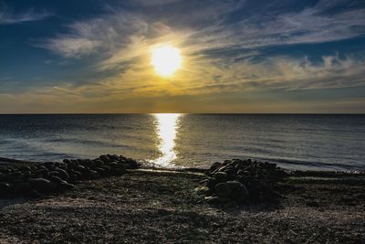 Scenic view of sea against sky during sunset