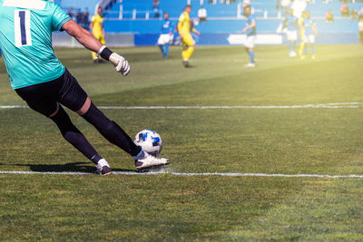 Man playing soccer on field