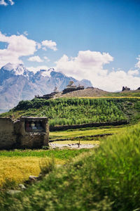 Scenic view of landscape against cloudy sky