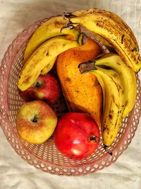 High angle view of fruits in basket on table