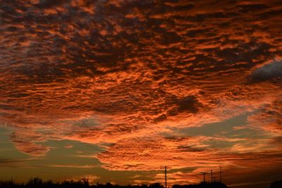 Low angle view of dramatic sky during sunset