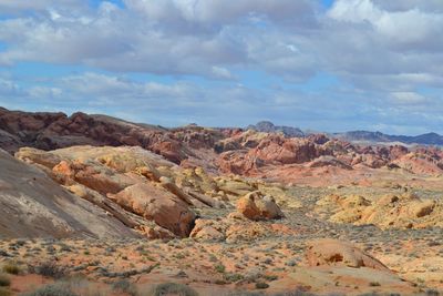 Scenic view of mountains against cloudy sky