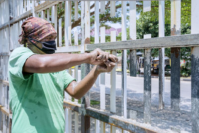 Man standing by railing