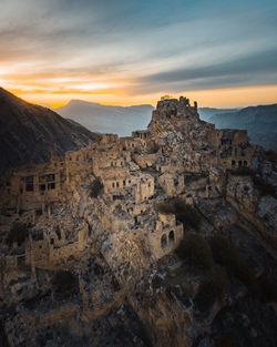 Castle on mountain during sunset