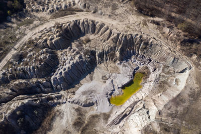 Abandoned industrial mining area. drone view of opencast mine filled with water. aerial shot