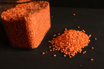 Close-up of orange lentils on table