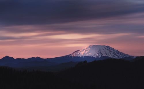 Scenic view of mountains against sky during sunset