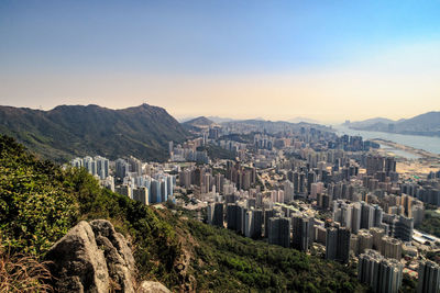 High angle view of buildings in city against clear sky