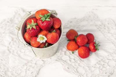 High angle view of strawberries in bowl on table