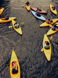 High angle view of people kayaking in sea