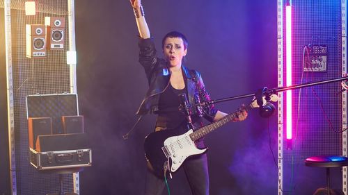 Low angle view of man playing guitar
