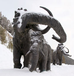 Statue against sky during winter