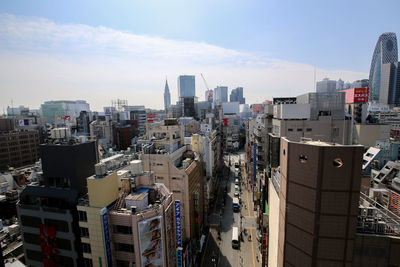 High angle view of buildings in city against sky